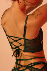 Close-up of the Gaia Lace Corset-Back Bra showing the lace-up corset back with ring-secured lacing, adjustable fit, and sheer embroidered mesh.